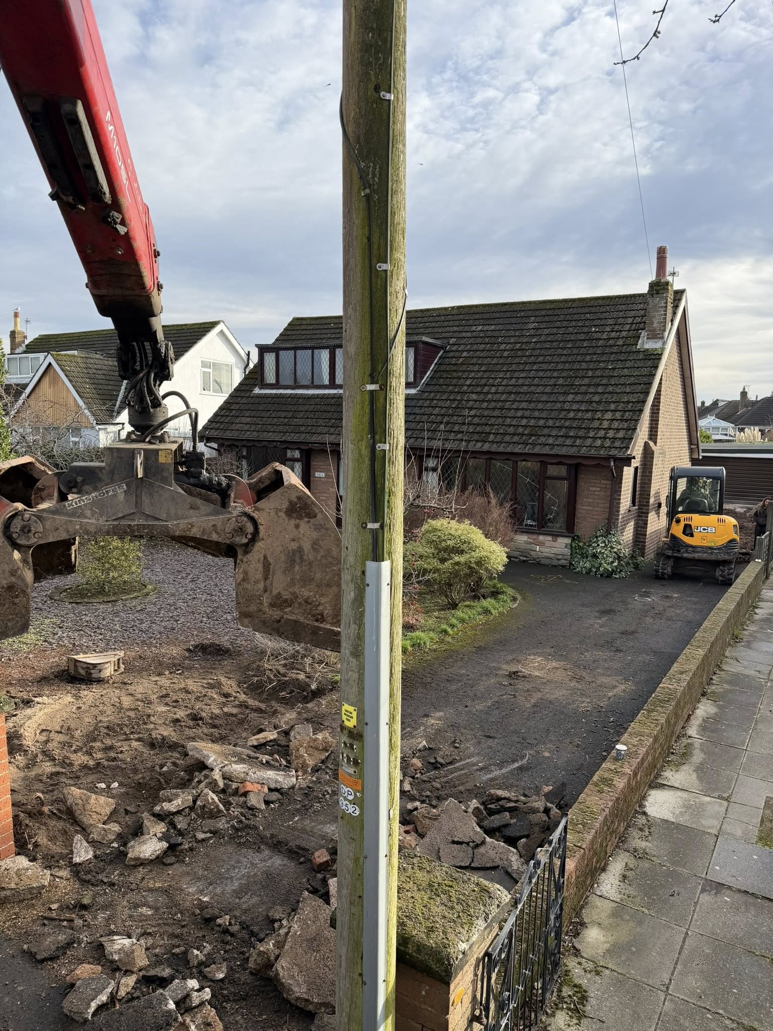 Garstang Ground Services collecting material off a residential property